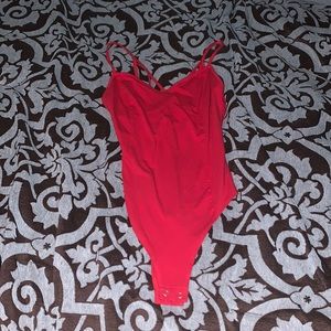 Red body suit criss cross back